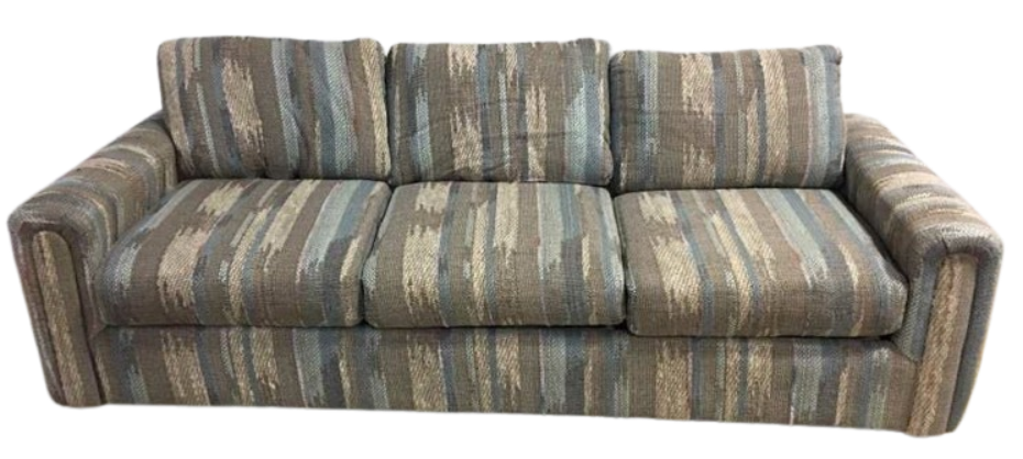 A vintage 1990s living room sofa with heavy, scratchy fabric featuring a muted teal, beige, and brown vertical brushstroke pattern.