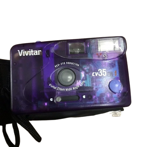90s Vivitar CV35 point-and-shoot 35mm film camera encased in a translucent Atomic Purple plastic shell that reveals its inner gears and flash wiring.