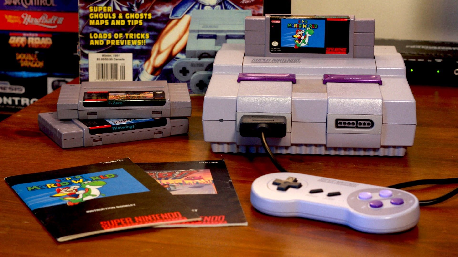 SNES console sitting on table with Super Mario World