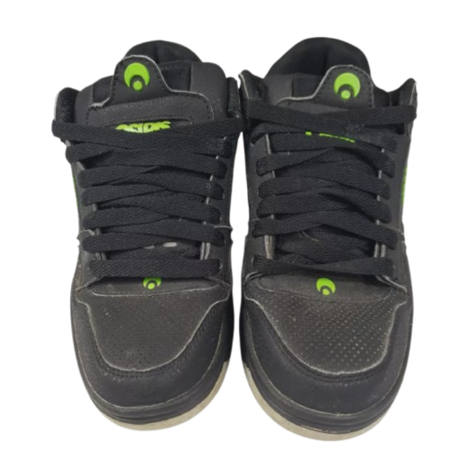 A pair of bulky black 1990s suede skate shoes with thick padded tongues and heavy-duty soles, capturing the iconic footwear style of 90s skate culture.