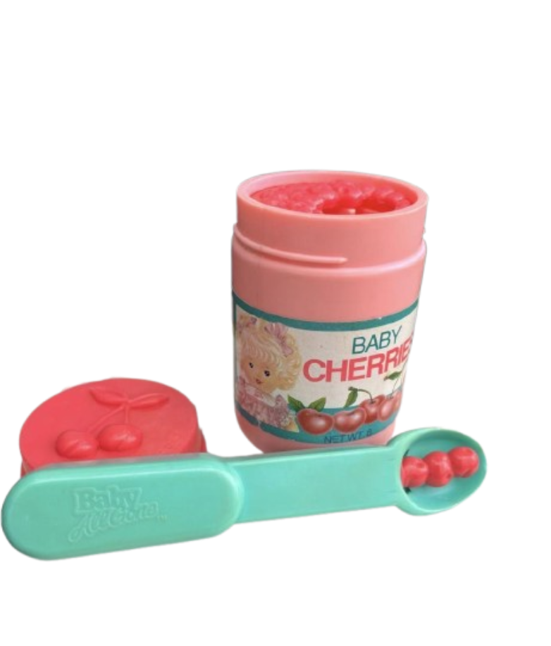 Baby All Gone Cherry Jar and Magic Spoon Playskool Baby All Gone plastic cherry baby food jar paired with its mint green magic spoon that made liquid food magically retract inside to simulate feeding a doll.