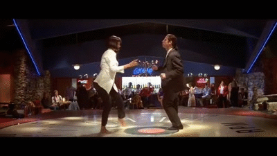 An animated GIF from Pulp Fiction featuring Mia Wallace (Uma Thurman) and Vincent Vega (John Travolta) doing their famous bare-foot twist dance at Jack Rabbit Slim's retro diner.