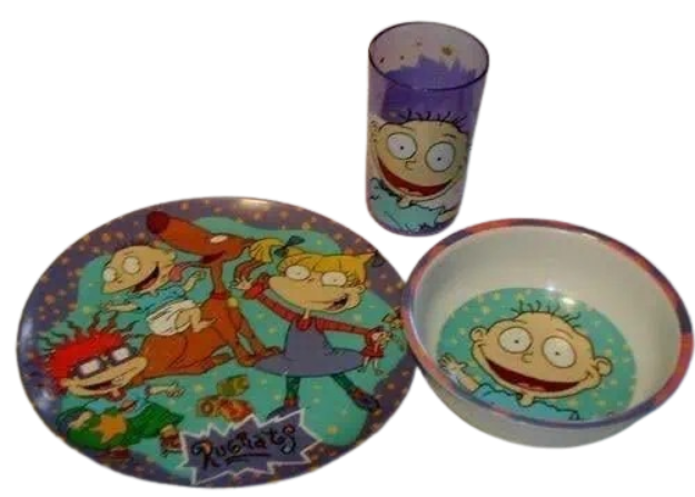 A collection of 90s table items including a melamine Rugrats plate and bowl set