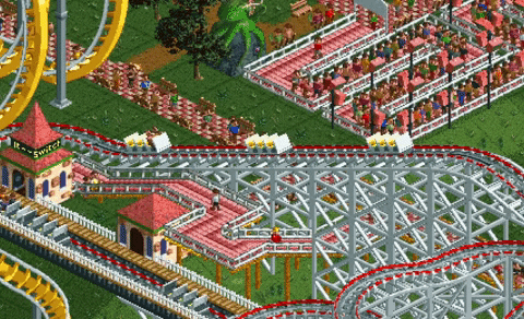 An animated GIF of isometric gameplay from Chris Sawyer's RollerCoaster Tycoon, showing wooden coaster trains zooming through tight turns past crowds of pixelated park guests.