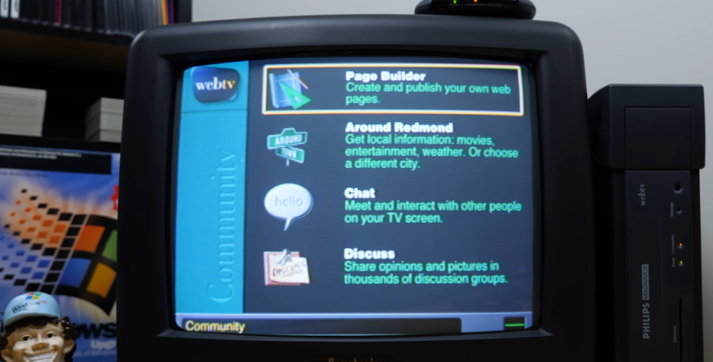 A Philips Magnavox WebTV set-top box displaying its living room Internet hub menu—featuring Page Builder, Chat, and Discussion options—on a curved CRT TV screen.