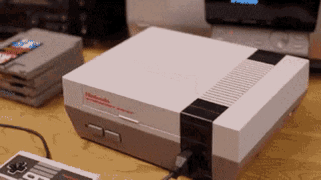Nintendo Entertainment System putting cartridge in and turning on  video