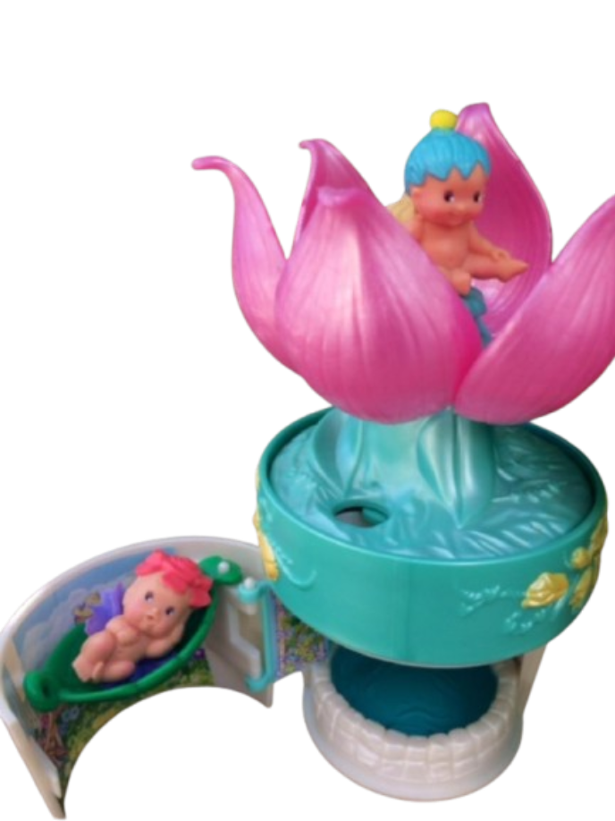 Secret Keepers Flower Hatching Fairy Playset Bluebird Pocket Secret Keepers pink lotus flower playset opening to reveal a tiny pastel fairy sleeping inside a water lily petal crib.