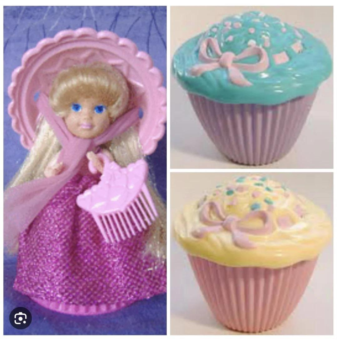 Cupcake Surprise Transforming Scented Doll Kenner Cupcake Surprise doll flipped open from a flexible rubber frosted cupcake wrapper into a blonde princess with her matching pink plastic bonnet comb.