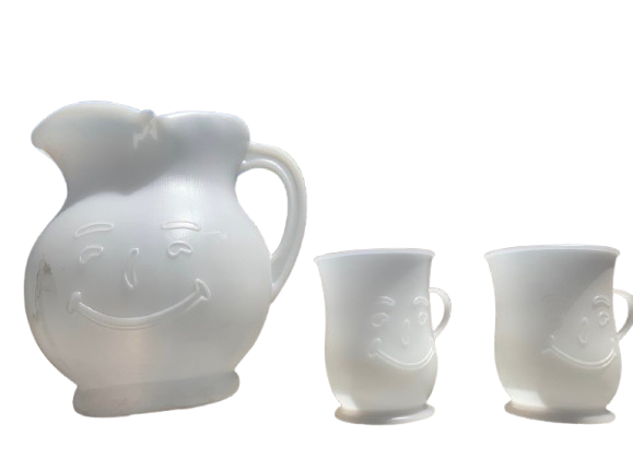 Kool-Aid Man Plastic Pitcher and Smiling Cups Set Retro white frosted plastic Kool-Aid pitcher and matching handle cups molded with the iconic grinning face of the Kool-Aid Man, the ultimate mail-in point-redemption prize for summer backyard playdates.