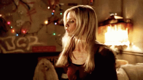 Animated GIF of Buffy Summers (Sarah Michelle Gellar) looking determinedly forward while brandishing a wooden stake ready to hunt vampires.